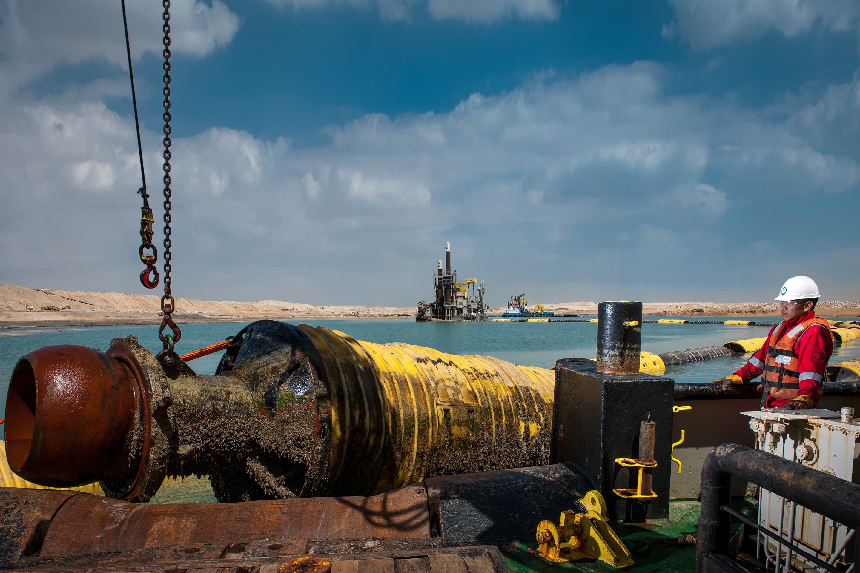 A floating pipeline being moved to another location