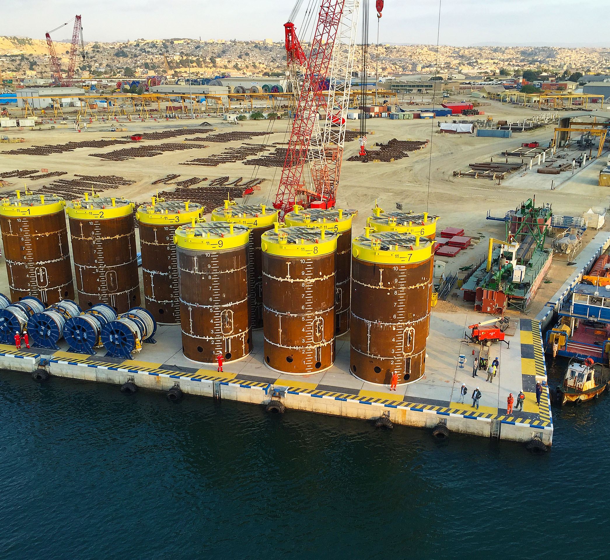 Some of the material, including suction piles and anchor chains, ready for transport