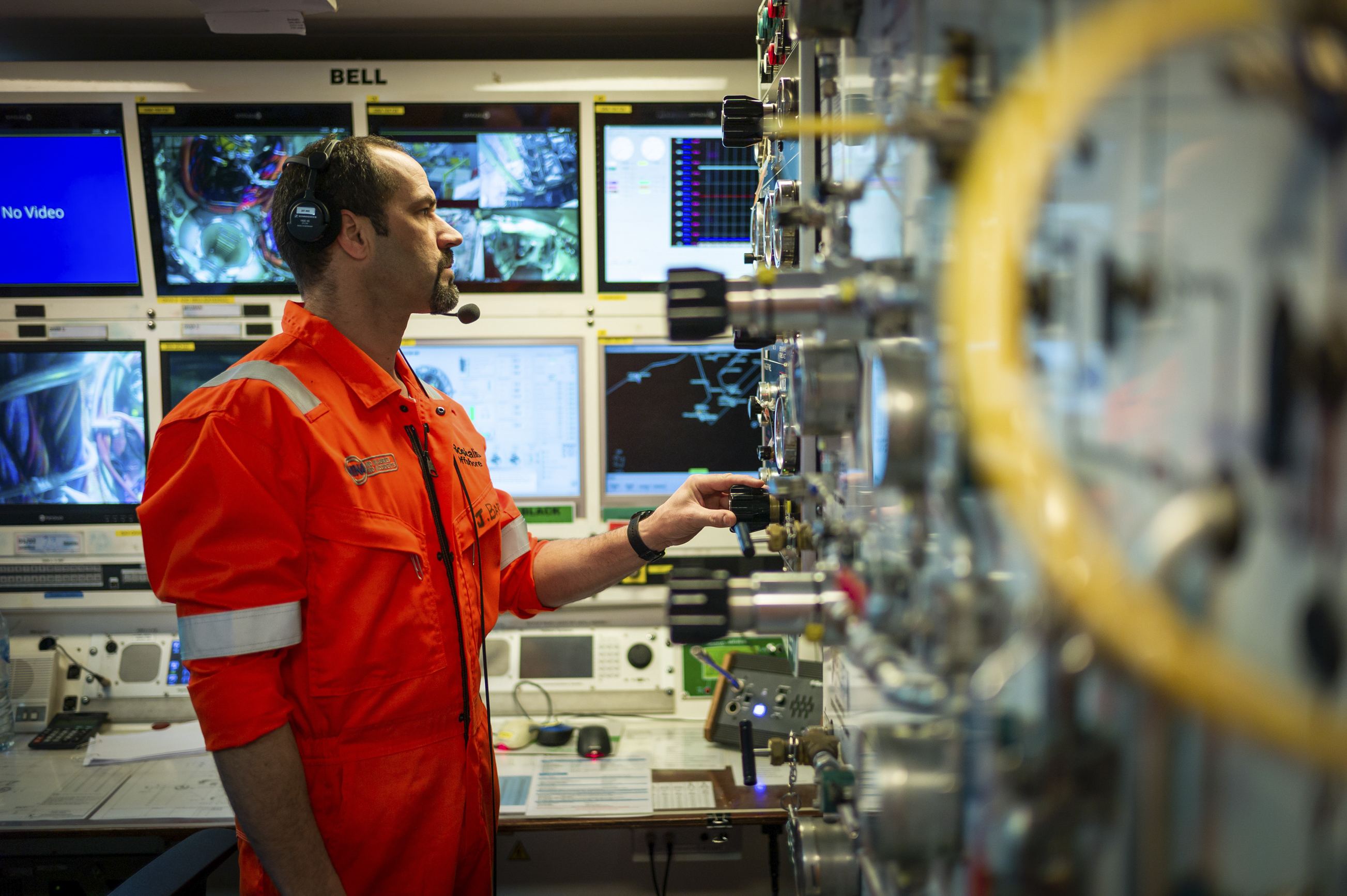 A life support team member checking the conditions in the compression chambers